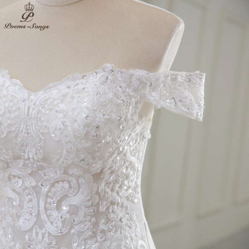 Abito da sposa a sirena con applicazioni, perline e fiori dallo scollo elegante a barchetta - Bridetobe.it