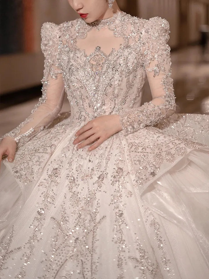 Abito da sposa di lusso con perline vintage e pizzo arabo con coda lunga e maniche lunghe applicate - Bridetobe.it