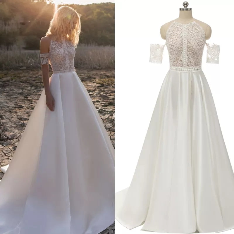 Abito da sposa bohemien con scollo rotondo e dettagli in pizzo e perle