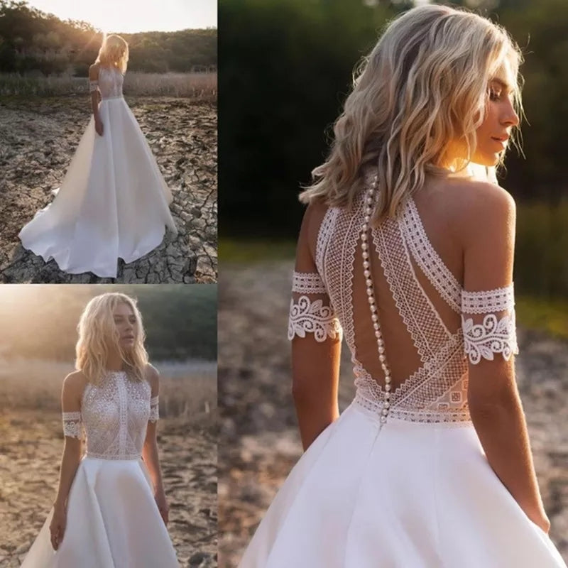 Abito da sposa bohemien con scollo rotondo e dettagli in pizzo e perle