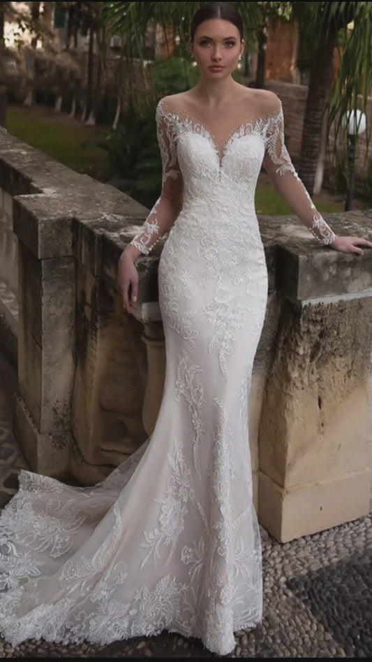 Luxurious wedding dress with V-neckline, long illusion lace sleeves and appliqued back details