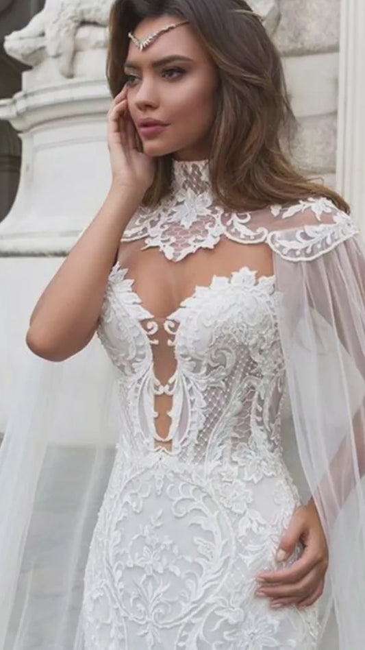 Mermaid wedding dress with sweetheart neckline and lace and button details