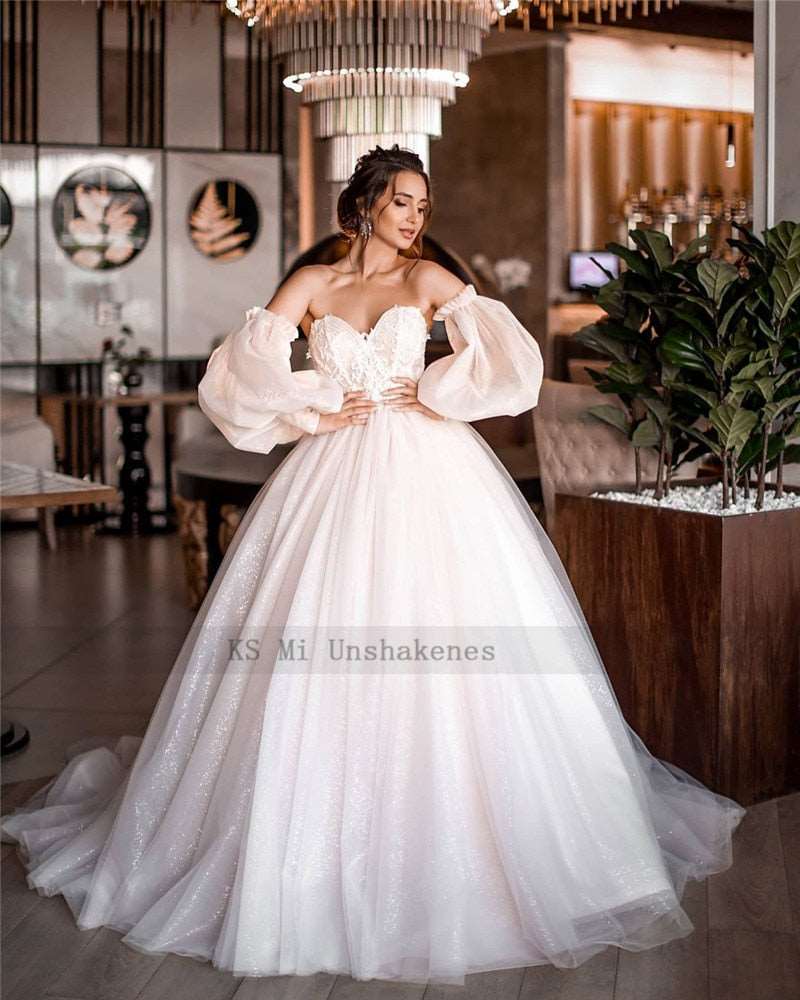 Abito da sposa boho 2023 rosa sporco con maniche a sbuffo staccabili e pizzo scintillante - Bridetobe.it