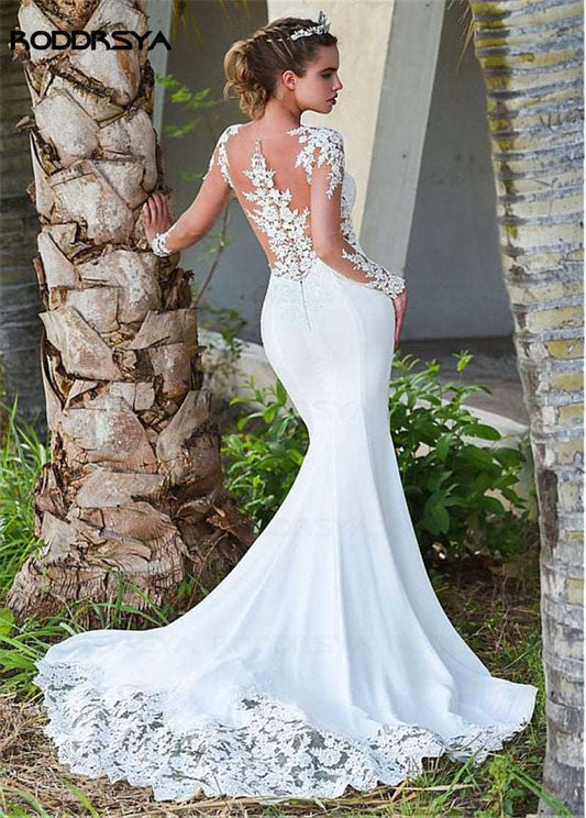 Abito da sposa a sirena con maniche lunghe e dettagli in pizzo trasparente - Bridetobe.it