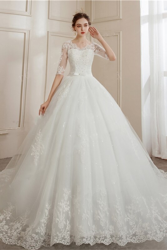 Abito da sposa con maniche lunghe in tulle con applicazioni di pizzo e scollo a V - Bridetobe.it