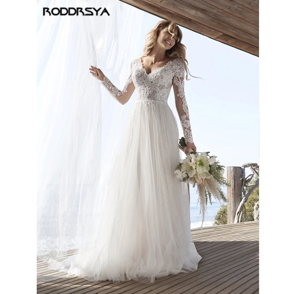 Abito da sposa in tulle con pizzo e maniche lunghe a linea A - Bridetobe.it