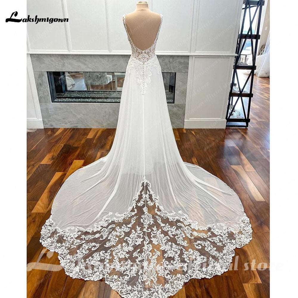 Abito da sposa in chiffon lussuoso con schiena scoperta, applicazioni in pizzo boho vintage e scollo a V (2023) - Bridetobe.it